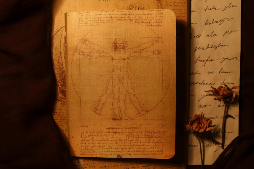 Artistic depiction of the Vitruvian Man on aged paper with dried flowers, evoking a vintage Renaissance feel.